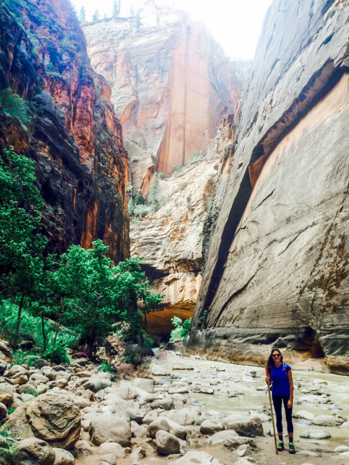 Lindsey standing in the virgin river in zion canyon