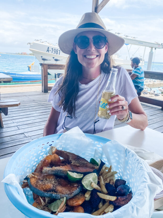 Visiting Aruba: Lindsey eating at Zeerovers