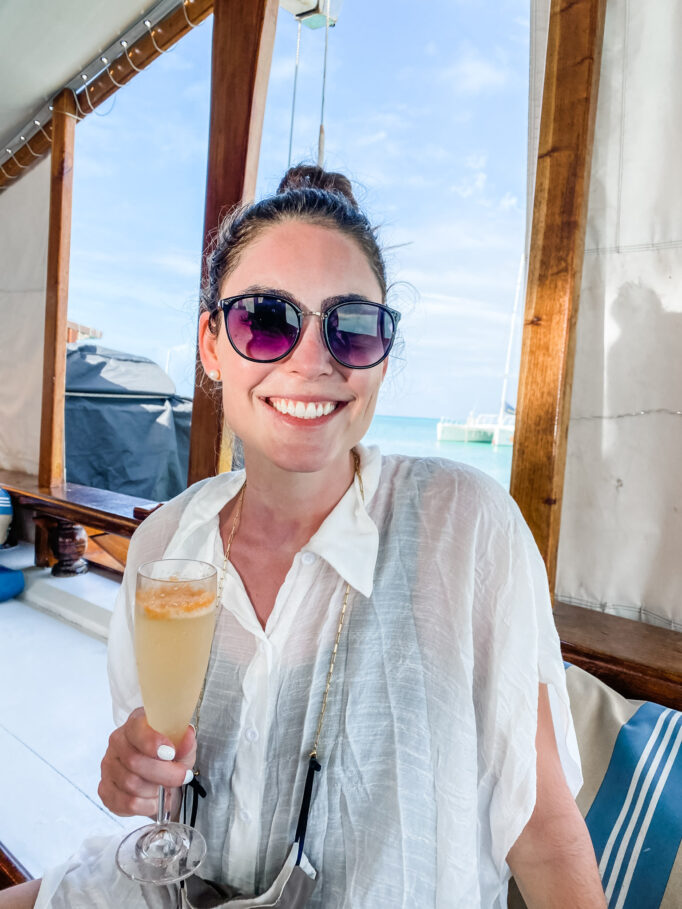 Lindsey with champagne on on Monforte Luxury Cruise